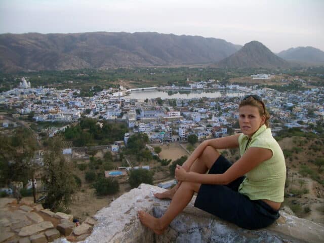A traveler enjoying slow travel in India, choosing local transport over flights to maintain an open itinerary and experience authentic cultural connections.