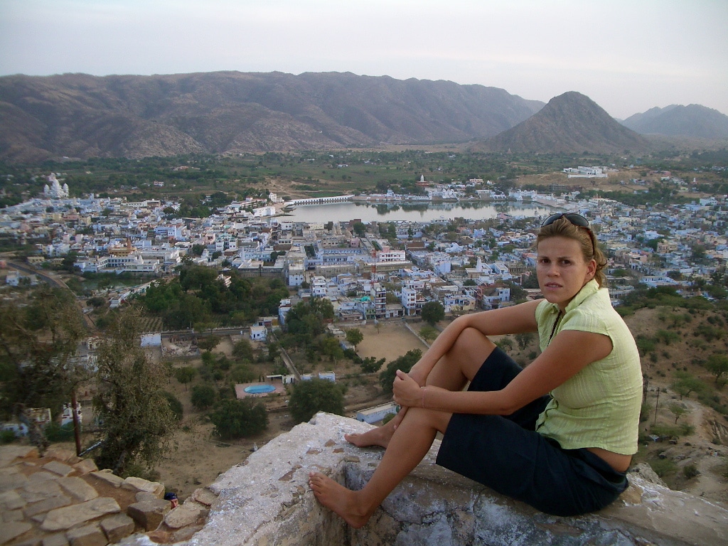 A traveler enjoying slow travel in India, choosing local transport over flights to maintain an open itinerary and experience authentic cultural connections.