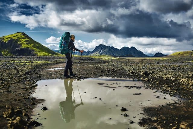 Solo traveller trekking in Iceland between tectonic plates