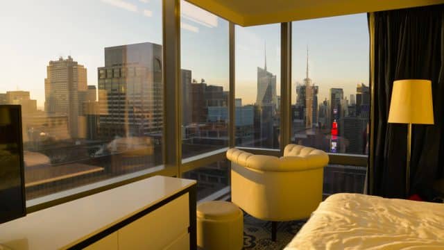 Hotel room with a view of the city