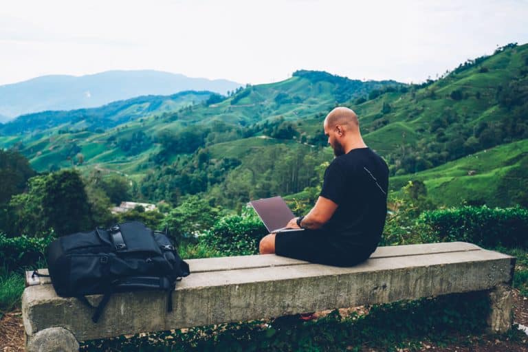 Traveller with laptop and a view